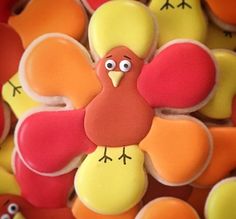 decorated cookies in the shape of turkeys with eyes