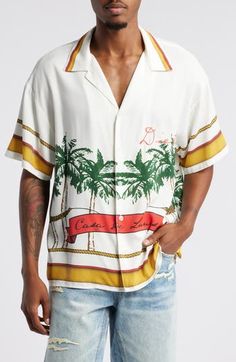 The paradise of the tropics inspires the artwork marking a camp shirt made of cotton and silky Tencel® lyocell in a fit that gives you lots of room to relax. 27" length; 45" chest (size Medium) Front button closure Notched collar Short sleeves 70% cotton, 30% Tencel® lyocell Tencel lyocell is a more-sustainably produced fiber made with closed-loop processing Machine wash, line dry Imported White Camp Shirt With Graphic Print, Graphic Print Camp Collar Hawaiian Shirt For Beach Season, Summer Shirt With Graphic Print And Camp Collar, Summer Graphic Print Short Sleeve Shirt With Camp Collar, Summer Graphic Print Collared Camp Shirt, Relaxed Fit Graphic Print Camp Shirt, Relaxed Fit Camp Shirt With All-over Print, White Camp Collar Top With All Over Print, Printed Tops With Relaxed Fit And Camp Collar