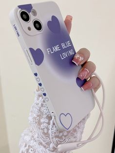 a woman holding up her phone case with hearts on it and the words flame blue loving