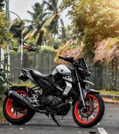 a black and red motorcycle parked on the street