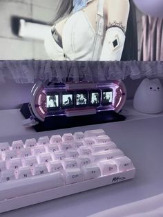 a white computer keyboard sitting on top of a desk