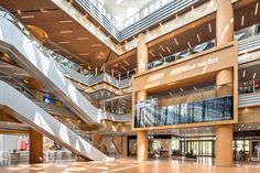 the inside of a large building with many stairs and balconies on each floor