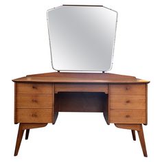 a wooden desk with a large mirror on it's top and two drawers underneath