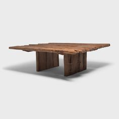 a table made out of wood with one leg extended and the other end turned down