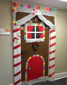 a door decorated with candy canes and decorations