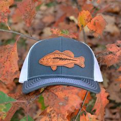 Custom Largemouth Bass Leather Patch Hat. This trucker style hat is perfect to add your personalized touch to. Choose from our variety of hat color and leather color options. Fish patch engraved into our high quality leather patch hat. PRODUCT DETAILS -------------------------- ~ Richardson 112 trucker style snapback hats ~ Largemouth Bass on our high quality 100% genuine leather patch hats ~ Hat Color Options: Black, Navy, Heather Gray / Black, Charcoal / White, Navy / White, Charcoal / Black, Trucker Hat Display Ideas, Brown Snapback Fishing Hat, Brown Snapback Hat For Fishing, Trucker Hat For Fishing With Flat Bill, Trucker Hat With Flat Bill For Fishing, Brown Fishing Cap, Brown Curved Brim Trucker Hat For Fishing, Casual Brown Trucker Hat For Fishing, Brown Snapback Trucker Hat For Fishing