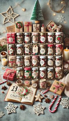 an assortment of christmas decorations and gifts on a table next to a book with the number twelve