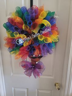 a colorful wreath hanging on the front door