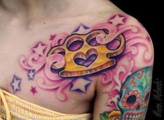 a woman with a crown tattoo on her chest