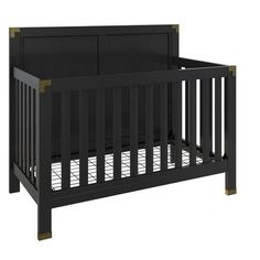 a black crib with gold trimmings on the sides and bottom panel, in front of a white background