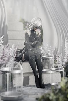 a woman sitting on top of a bench next to a birdcage filled with flowers