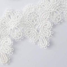 This delicate white lace choker is the essence of romance in a necklace. Its light, delicate and comfortable to wear. Features an adjustable clasp closure. Sold as one individual choker necklace. Delicate White Lace With Lace Trim, Lace Choker With Lace Trim As Gift, Elegant White Crochet Lace Jewelry, White Lace Choker Gift, Delicate White Choker, White Lace Wedding Choker, White Lace Jewelry With Lace Trim, White Choker Necklace, White Lace Choker