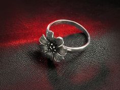 "Beautiful and detailed Japanese cherry blossom ring made from sterling silver. Hallmark: 925 Approximate weight: 3.7 g Width: 0.59 inches Shipping: - we prepare our orders ready for shipping in 3-7 business days, all items are made to order, they are not kept in stock; - we will provide tracking number as soon as order will be shipped. EXPRESS shipping: if you are interested in FAST delivery, we offer very fast and high quality \"door to door\" service by UPS Express. Delivery: within Europe - Formal Flower Ring Stamped 925, Sterling Silver Flower Ring For Formal Occasions, Formal Flower Shaped 925 Silver Ring, Formal Sterling Silver Flower Ring, Sterling Silver Flower Jewelry, Cherry Blossom Ring, Japanese Cherry Blossom, Sterling Silver Flowers, Flower Jewelry