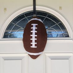 a football is hanging on the front door