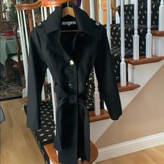 Belted Kenneth Cole Wool Coat With Front Pockets Deep Enough To Hold Gloves. Tags Have Been Removed But Cost Was Never Worn. 35” Long From Top Of Shoulder. Formal Black Wool Coat With Button Cuffs, Fitted Black Wool Coat With Double Button Closure, Semi-formal Long Sleeve Wool Coat With Double Button Closure, Black Designer Wool Coat With Button Closure, Kenneth Cole Black Perfume, Black Wool Coat, Kenneth Cole, Black Wool, Wool Coat