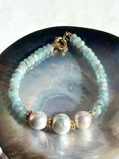 Elegant aquamarine bracelet made of freshwater pearls and natural aquamarine from Brazil. All metal parts gold vermeil (18k gold over sterling silver).  Bracelet length is 19 cm or 7,5 inches (please contact me if you need adjustments).  Beautiful gift for any occasion, especially for those who are born in March as aquamarine is the birthstone for this month.  Comes in a gift box. Shipment worldwide with registered post.  SPECIAL OFFERS: ✦ Special 10% OFF when you order 2 items!! Apply Coupon Co Aquamarine Bracelet Beads, Aquamarine Bracelet, Aquamarine Jewelry, Bracelet Gemstone, Beaded Bracelets Diy, Natural Aquamarine, Bead Jewellery, Bracelet For Women, Gemstone Bracelets