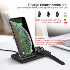 the charger is attached to an iphone and charging it on a desk next to a laptop