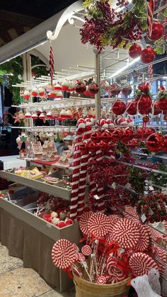 candy canes and candies are on display in a store