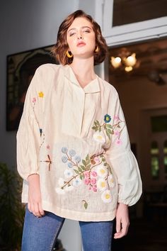 Ivory cotton top with multi colored floral hand embroidered front and back. - Aza Fashions Special Outfits, Floral Embroidered Shirt, Boxy Shirt, Embellished Shirt, Fashion Top Outfits, Dress Design Patterns, Ivory Tops, Pant Suit, Floral Tunic