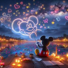 mickey mouse is sitting on the dock with candles