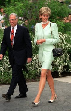 a man and woman walking down the street