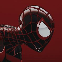 a close up of a spider man's face on a red background