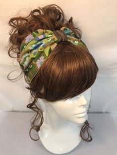 Fabric turban head band in a green floral retro cotton print,based on the 1940s land girl style and 1950s Rockabilly fashions. A real statement piece with a standard 1 inch width inner Alice band attached within the lining to provide an easy to wear design. Our range of turban bands are the perfect easy to wear accessory and are worn exactly as an Alice band finishing behind the ears. (These bands do not go all the way around the back of the head, so are perfect for all hair styles. This unique Vintage Summer Bandana, Adjustable Green Bandana, Green Bohemian Spring Bandana, Spring Green Bohemian Bandana, Adjustable Green Headscarf For Spring, Adjustable Green Headwrap With Matching Headband, Green Bohemian Headband Bandana, Green Bohemian Headband For Summer, Bohemian Green Headband For Summer