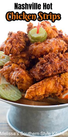 chicken strips with pickles and celery in a metal bowl