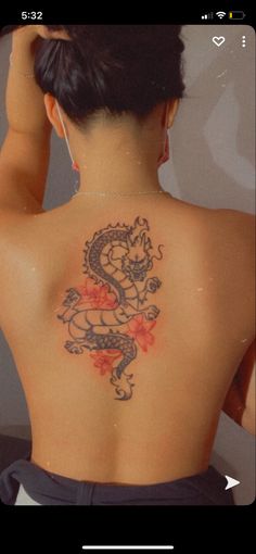 Dragon back tattoo with 3 pink flower tattoo Flower Thigh Tattoos, Thigh Tattoos, Dragon Tattoo, Thigh Tattoo, Watercolor Tattoo, Tattoos