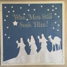 a paper cut out of the nativity scene