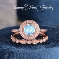 a ring with an oval blue topaz surrounded by smaller round diamonds on a velvet cushion