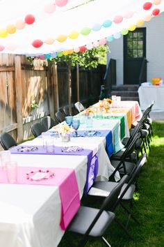 an outdoor table set up for a party