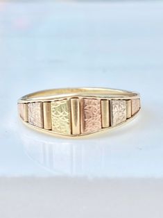 This duel colored rose and yellow gold panel band has a descending width. It is very unique, with delicate engraved gold. Marked for 14K. A size 8. It weighs 2.9 g. The width in front is 7 mm down to 2.1 mm in the back. Engraved Ring, Gold Engraving, Engraved Rings, Wedding Rings Engagement, Wedding Engagement, Jewelry Rings, Rings For Men, Ring Size, Wedding Rings