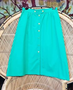 Koret Petites's women's green, cotton and polyester a-line skirt with two different shades of green buttons at front. Skirt includes pockets! Excellent vintage condition: no stains or tears. See all photos Fits like a MD, check measurements below for a sure fit.  Waist - 30 inches Length - 30 inches Hip - 48 inches If you have any questions or would like to see more photos, please don't hesitate to message me. Office Wear Women, Plaid Pleated Skirt, Womens Skirts, Button Skirt, Different Shades Of Green, Mohair Cardigan, Plus Size Vintage, Vintage Inspired Outfits, Skirt With Pockets