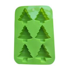 christmas tree shaped ice cube tray with green frosting on the bottom and four small trees at the top