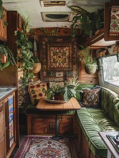 the interior of an rv with plants and rugs