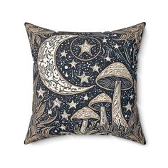 a decorative pillow with an image of mushrooms and stars in the night sky on it