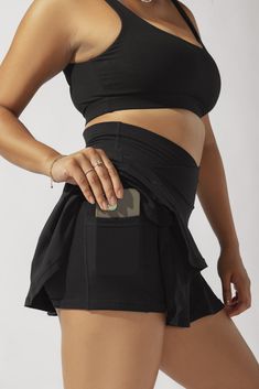 Our most curve-accentuating skort designed for endless twirls and booty shakin’. Meet your newest wardrobe staple. Compression Level: Performance Level: Black 4-way Stretch Bottoms For Night Out, Black Stretch Skort For Workout, Stretch Black Workout Skort, Black Stretch Workout Skort, Black Bottoms With Built-in Shorts And 4-way Stretch, Sporty Black Bottoms With Crossover Waistband, Black Sports Bottoms With Crossover Waistband, Chic Black Stretch Activewear, Fitted Black Bottoms With Crossover Waistband