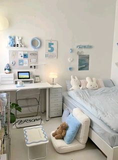 a bedroom with white walls and blue accents