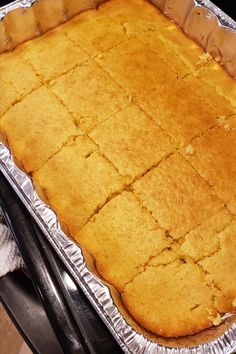 an uncooked cake sitting on top of a metal pan