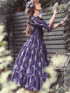 A true purple classical dress depicting gorgeous blooming flowers and a knit bustier that looks like a picture frame with flowers embroidered on it. The collar part has a design that looks like overlapping pleats, and is an elegant item made with a generous amount of fabric. For a neat and elegant young lady. 
 
 Item 
 
 Dress (S size, M size, L size, XL size) 
 Bustier (FREE size) 
 Headband ( FREE size ) 
 Hair ribbon ( FREE size ) 
 
 
 Dress size 
 
 
 S size 
 
 Length: 115cm 
 Upper body Purple Floral Print Dress With Fitted Bodice, Picture Frame With Flowers, Free Size Dress, Frame With Flowers, Classical Dress, Hair Ribbon, Bustier Dress, Classic Dress, Bustiers