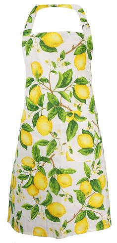 a white dress with lemons and green leaves on the front, as well as an apron