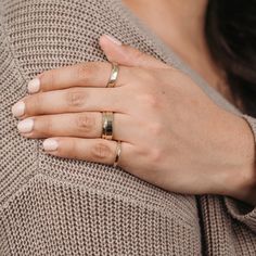 Handcrafted by our team of skilled artisans and made from 100% recycled gold, The Rosalind is a signature yellow gold stacking ring. The delicate hammered texture, inspired by the Rosalind moon, is paired with the longevity and brilliance of ethical gold. A new take on an everyday classic - this yellow gold stacking ring is the perfect staple for everyday wear and pairs effortlessly with any ring stack. Hammered Yellow Gold Ring Features: 100% recycled 10k or 14k yellow, rose or white gold ring Yellow Gold Stacking Rings, Gold Stacking Ring, 10k Gold Ring, Engraving Fonts, Stack Ring, Ring Stack, Gold Ring Stack, Hammered Gold, 14k Gold Ring