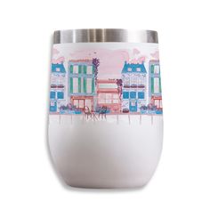 a white cup with colorful buildings painted on the front and sides, sitting in front of a white background