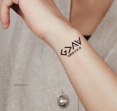 a woman's arm with a tattoo on it that says vaz and is written in cursive letters