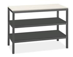 a black and white table with two shelves on each side, one shelf is empty