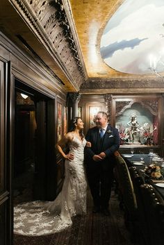 a bride and groom standing in the hallway of a train car at their wedding reception