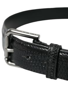 Discover the epitome of Italian craftsmanship with this exquisite belt from Dolce & Gabbana. Made from high-quality black leather, it features an elegant metal buckle, adding a touch of class and character to your ensemble. Perfect for bringing a refined finish to both formal and casual looks, this belt encapsulates luxury and style. Material: 100% LeatherColor: BlackWidth: 3cmLogo detailsMade in Italy Luxury Belts With Silver Buckle, Elegant Luxury Belt With Silver Buckle, Luxury Black Belt Buckles, Luxury Silver Leather Belt, Luxury Modern Belts With Silver Buckle, Luxury Modern Belt With Silver Buckle, Belts Silver Black, Luxury Elegant Black Belt Buckles, Luxury Silver Men's Belt