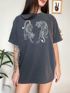 Get OBSESSED with the Vintage Tiger Aesthetic with this cute Vintage Tiger Shirt! This Tiger Comfort Colors® Tshirt is super soft and comfy! Size up for a Trendy Oversized Look! SHIPS FREE! SIZING TIPS: Size up 2-3 sizes from your "usual size" to get the "Oversized" Look! (2 sizes up is most common, and 3 sizes up is more dramatic) For a "relaxed fit" order your "usual size". When in doubt, lay your favorite fitting Tee flat and measure armpit to armpit and compare the width against the Size Cha Aesthetic Tiger, Tiger Aesthetic, Relaxed Fit Tshirt, Tiger Tshirt, Tshirt Painting, Vintage Tiger, Tiger Shirt, Comfort Colors Tshirt, Comfort Colors Tee