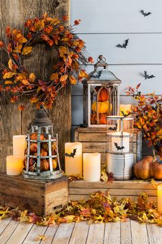 candles and pumpkins are sitting on the steps